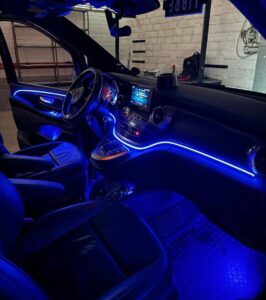 Shows a mercedes van with blue LED lights